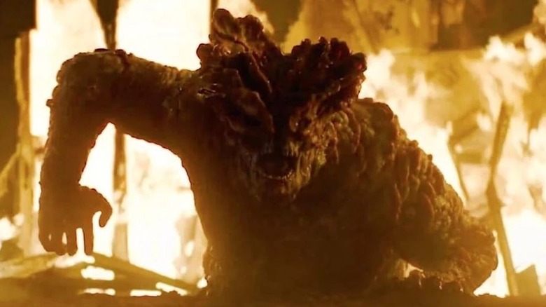 Bloater emerging from the fire on The Last of Us