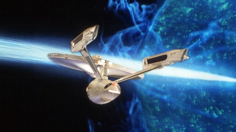 The Enterprise-A cruises by a blue star emitting a solar flare in Star Trek V: The Final Frontier