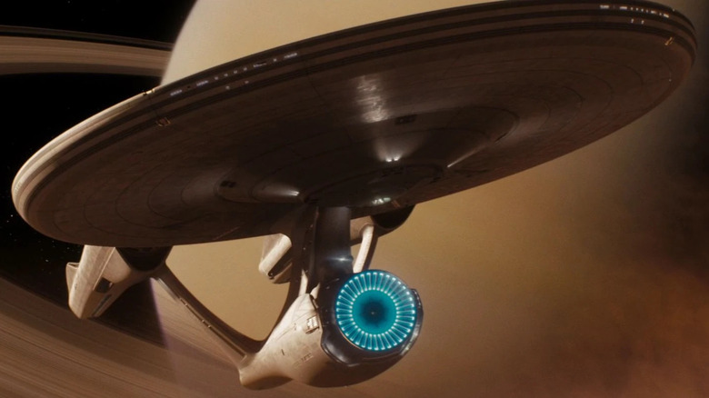 The Enterprise passes through Saturn's rings in Star Trek