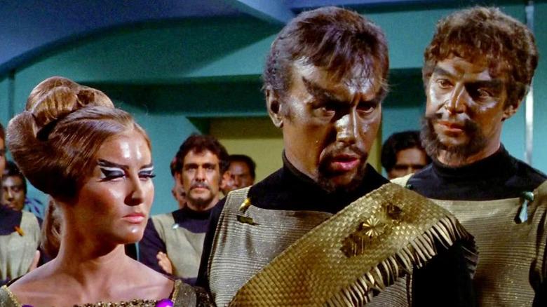Susan Howard as Mara and Michael Ansara as Kang surrounded by other Klingons on Star Trek: The Original Series