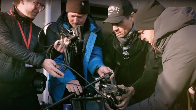 Crew members with a camera