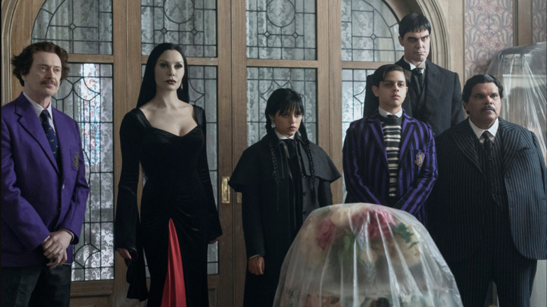 The Addams Family (and Principal Dort) look over their new digs in Wednesday