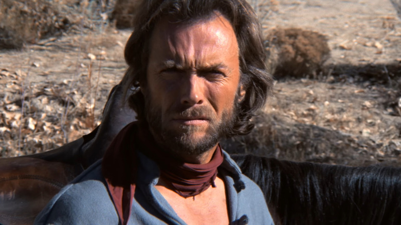 Josey Wales standing near his horses in The Outlaw Josey Wales