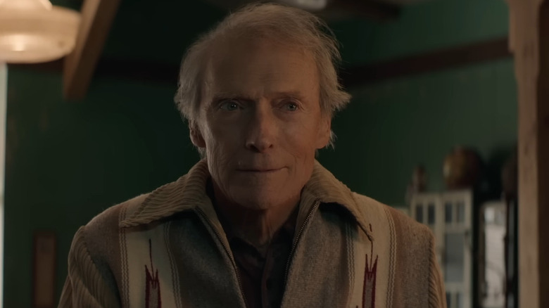 Mike Milo sitting at a restaurant bar in Cry Macho