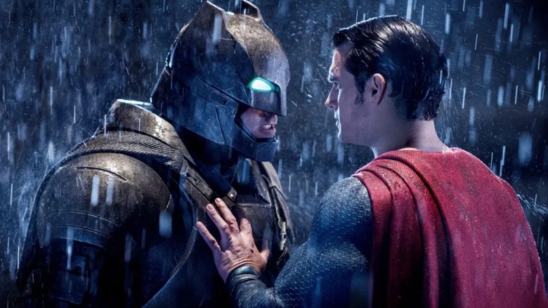 Superman with his hand against Batman's chest in Batman v Superman: Dawn of Justice