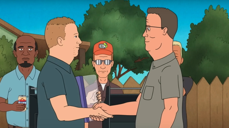 Bobby and Hank holding hands in front of the grill and the alley guys in King of the Hill