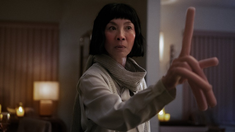 Michelle Yeoh as Evelyn Wang with hot dog fingers in "Everything Everywhere All At Once"