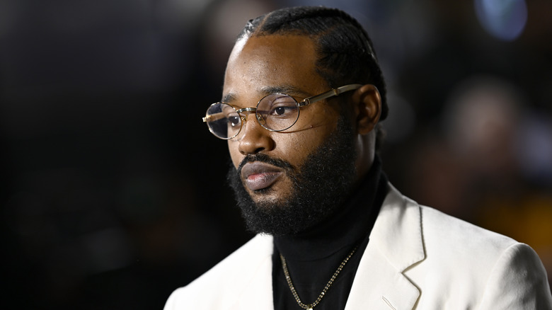 Ryan Coogler in formal white attire