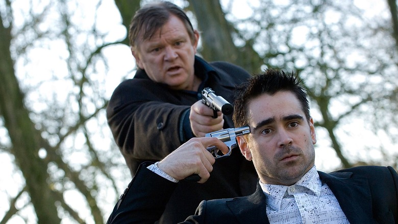 Brendan Gleeson holds Colin Farrell at gunpoint in In Bruges