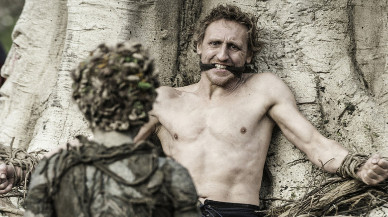 First Man tied to a weirwood tree with a Child of the Forest in front of him on Game of Thrones