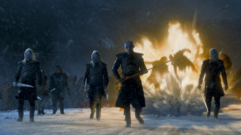 White Walkers looking cool while walking away from an explosion on Game of Thrones