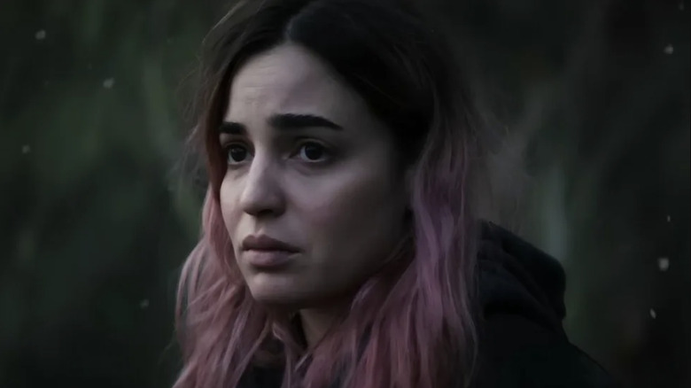 Alice looks pensive among the snow in Evil Dead Burn