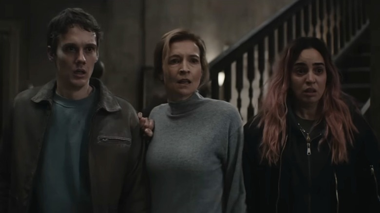 The family looking scared in Evil Dead Burn