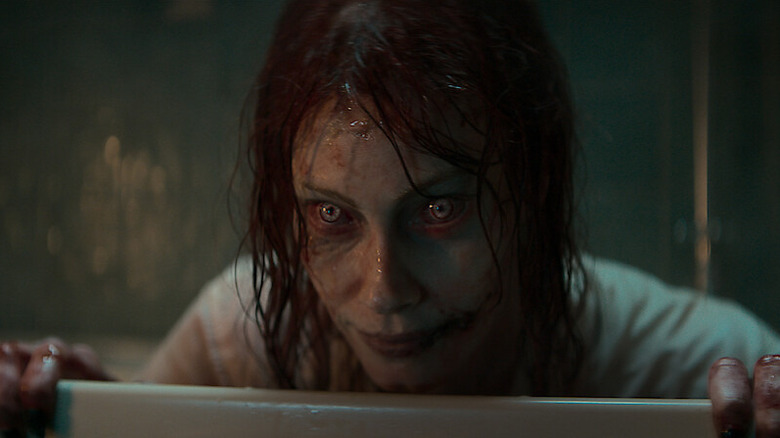 Deadite Ellie takes a bath in Evil Dead Rise