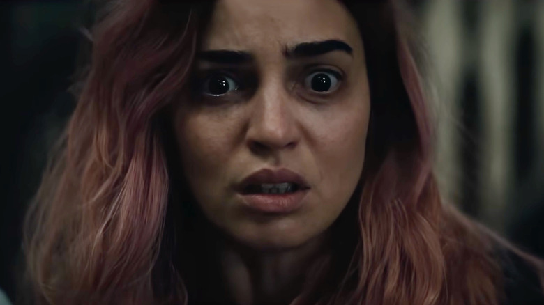Alice looking alarmed and horrified in Evil Dead Burn