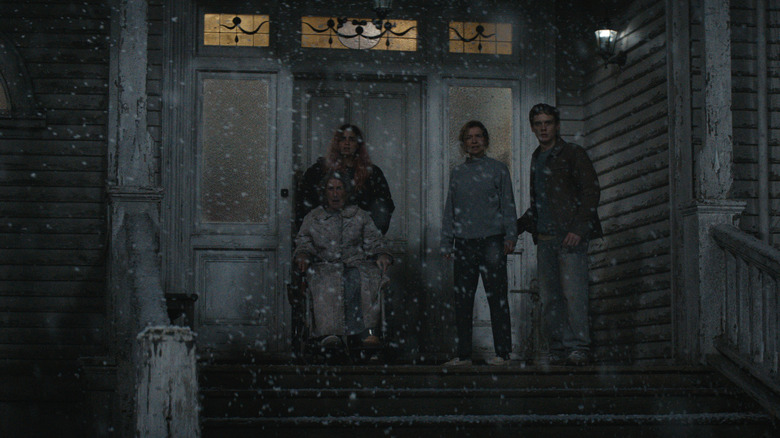 Polly, Alice, Susan, and Joseph stand on the porch in the snow in Evil Dead Burn