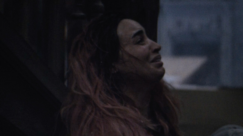 A woman is terrified in Evil Dead Burn