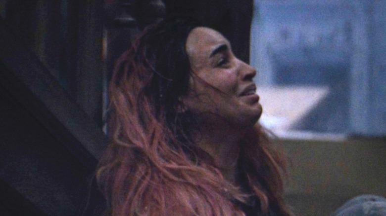 A woman is terrified in Evil Dead Burn