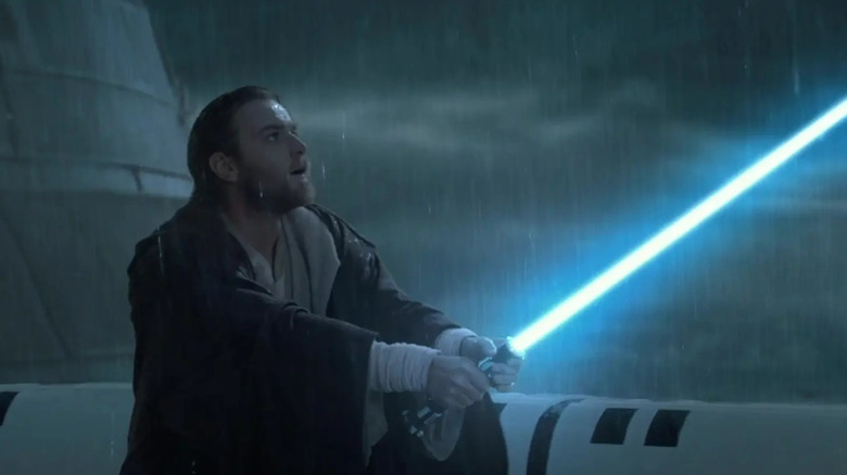 Obi-Wan Kenobi in the rain with his lighsaber out in Star Wars: Episode II - Attack of the Clones