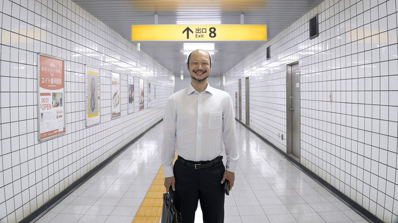 The Walking Man smiles in Exit 8