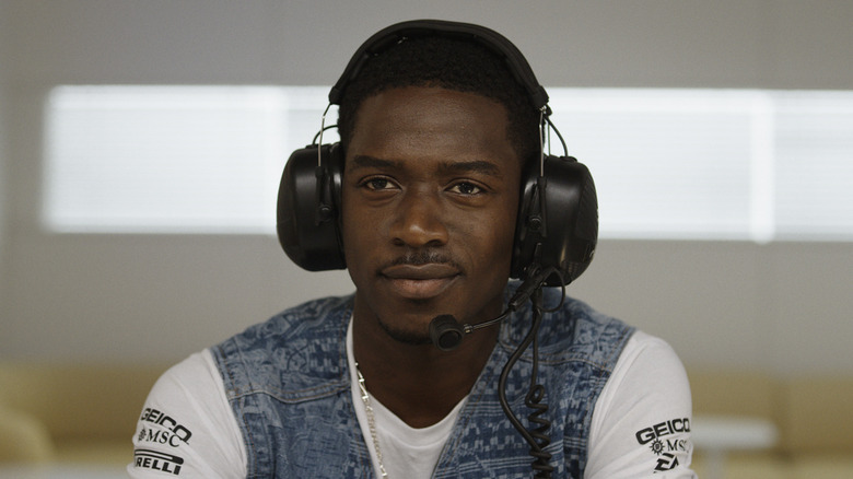 Joshua Pearce smiling with a headset on in F1
