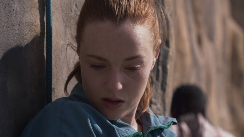 Jax looks down while Luce carries on in Fall 2: Deadpoint