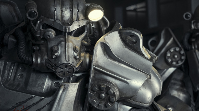 A man in power armor exuding aura in Fallout