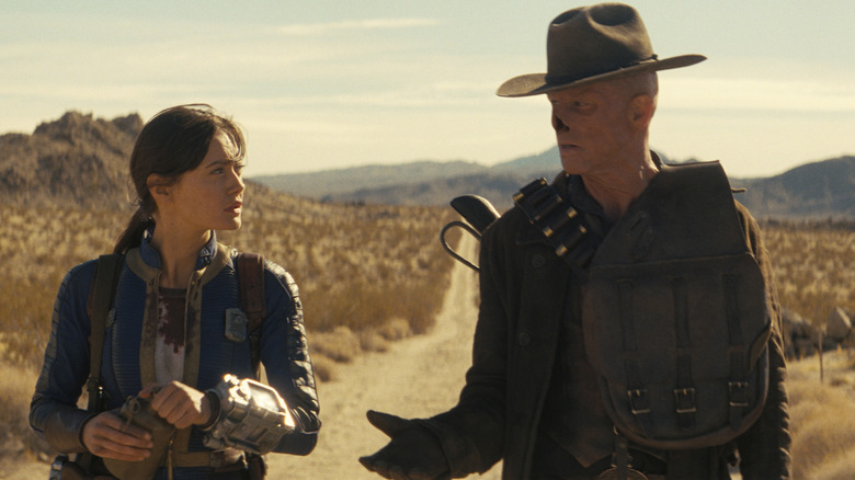 Lucy and the Ghoul walking through the wasteland in Fallout