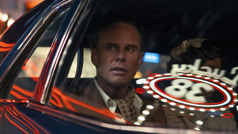 Walton Goggins as Cooper Howard in the back seat of a car in Fallout