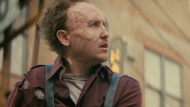 Thaddeus showing a weird mouth thing growing out of his chest in Fallout