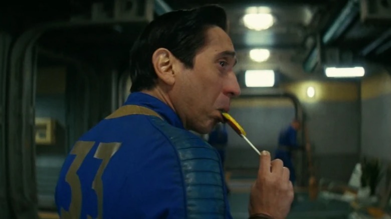 Rodrigo Luzzi's Reg McPhee eating a lollipop on Fallout