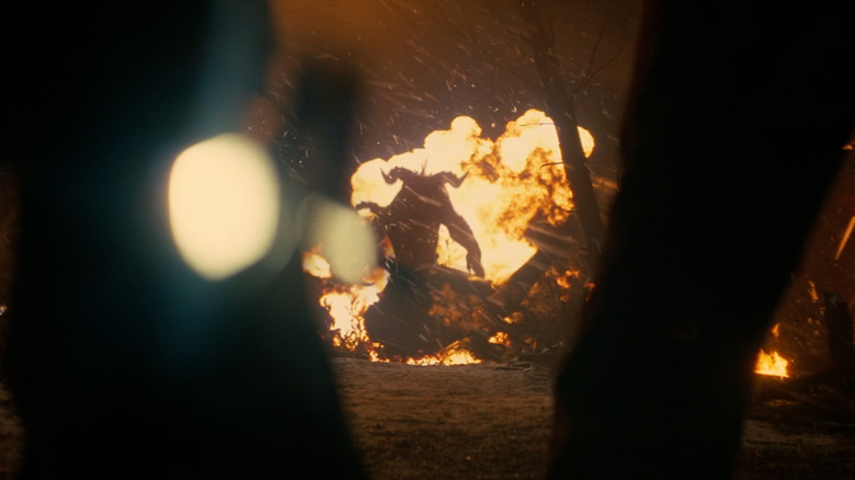 Cooper Howard trapped in a faulty power armor about to be killed by a deathclaw in Fallout