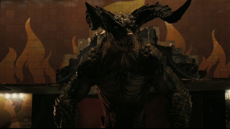 A Deathclaw coming out of a casino to eat some delicious humans in Fallout