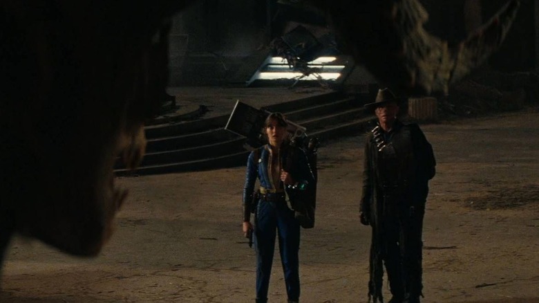 Lucy and the Ghoul about to be devoured by a Deathclaw in Fallout