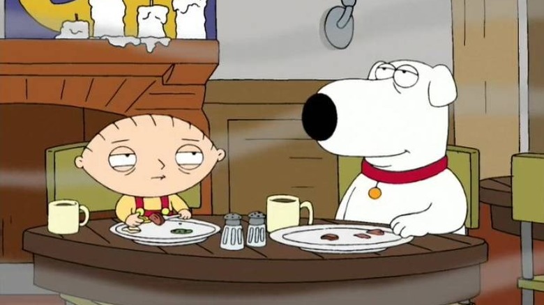 Brian and Stewie surrounded by smoke in a cafe in Family Guy's Road to Europe