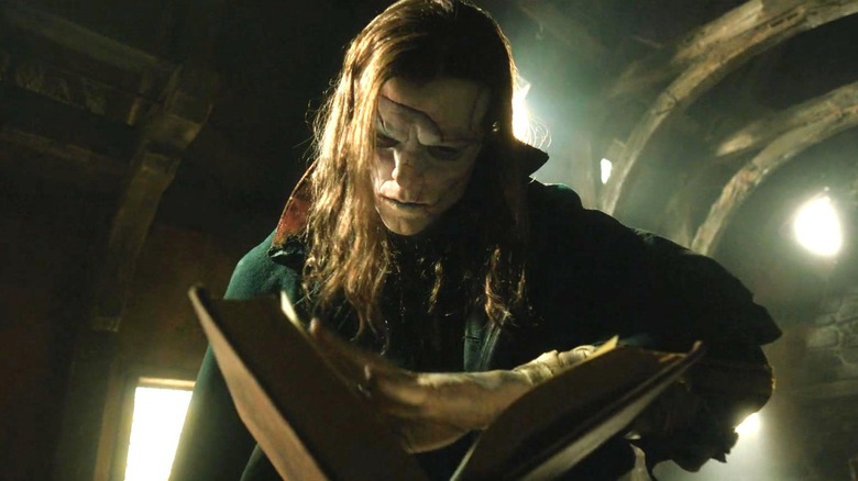 Frankenstein (2025) - The Creature opening a book