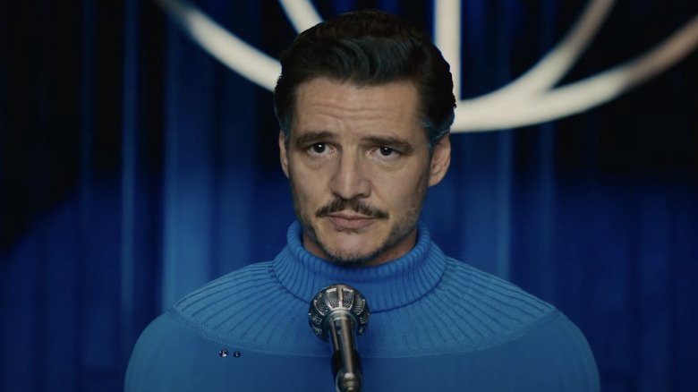 Pedro Pascal stands in front of a microphone as Reed Richards in The Fantastic Four: First Steps