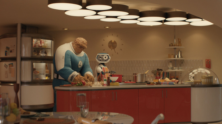 H.E.R.B.I.E. and Ben Grimm cook some food together in The Fantastic Four: First Steps