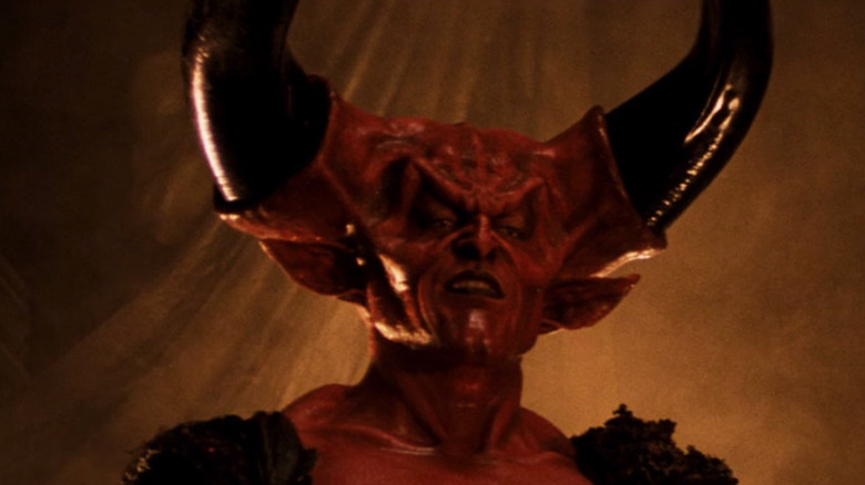A red skinned devil with enormous black horns