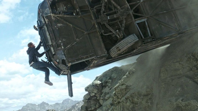 Brian scales a hanging bus in Furious 7
