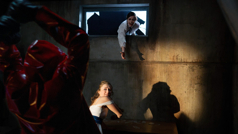 Lori and Megan attempt to escape the killer in Fear Street: Prom Queen