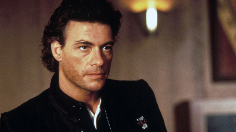 Max looking serious with some bad hair in Timecop