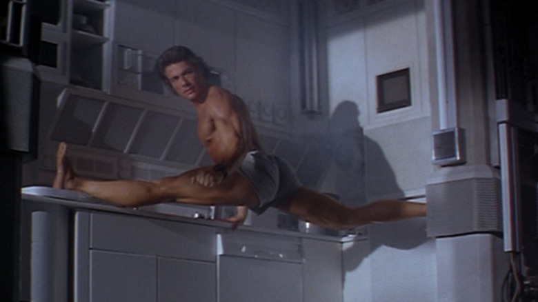 Max doing a split in his kitchen in Timecop