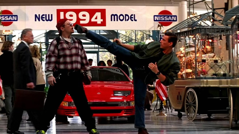 Max threatening to kick a mugger in the face at the mall in Timecop