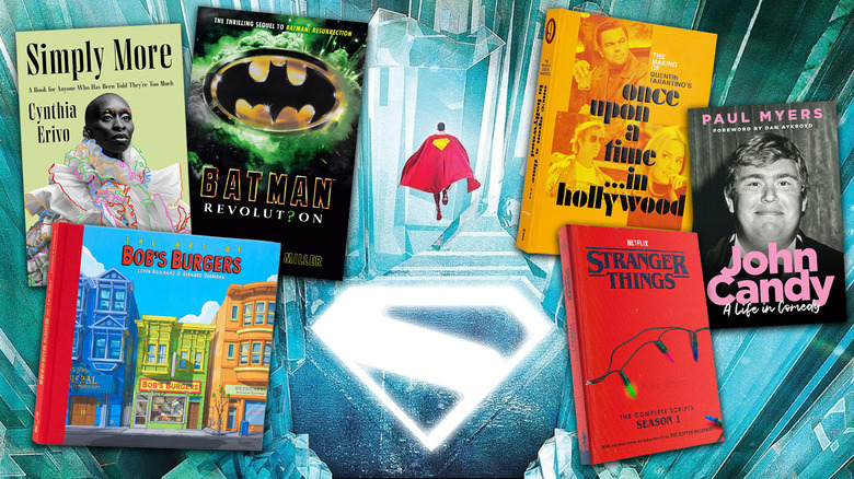 Images of book covers for Simply More, Batman: Revolution, The Art of Bob's Burgers, The Making of Once Upon a Time in Hollywood, John Candy: A Life in Comedy, and Stranger Things Season 1 script book on top of the cover for Superman: The Art and Making of the Film