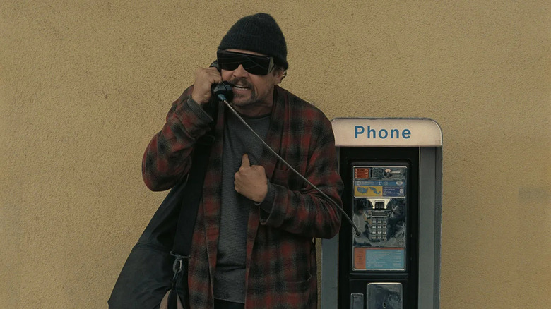 Bob on the phone in One Battle After Another