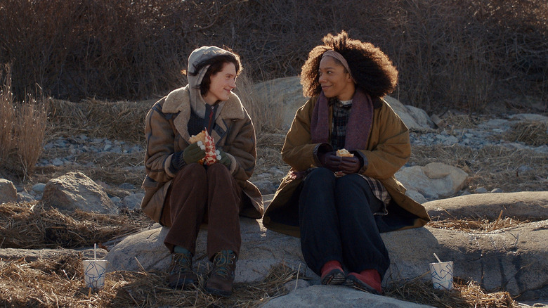 Agnes and Lydie sitting on the beach and talking in Sorry, Baby