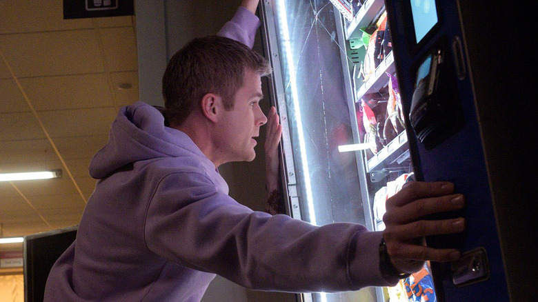 Bobby rocking a vending machine in Final Destination Bloodlines