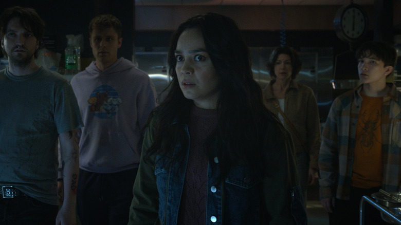 Erik, Bobby, Stefani, Darlene, and Charlie stand in shock and awe in Final Destination Bloodlines