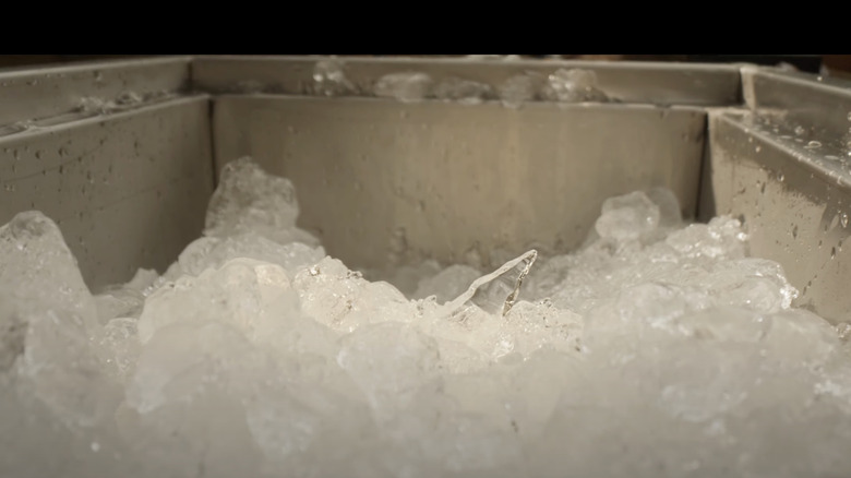 A shard of glass protrudes from a sink full of ice in Final Destination Bloodlines